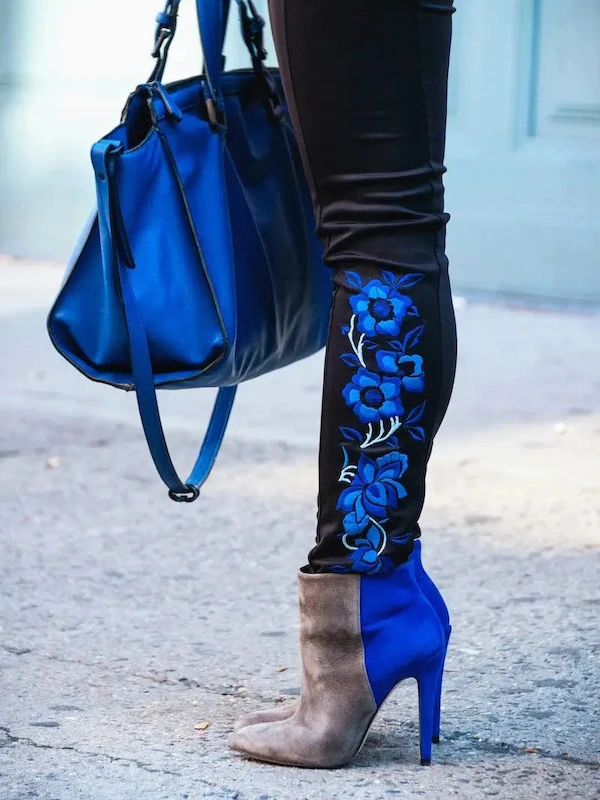 blue floral boots and a blue purse