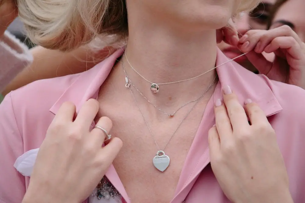 close-up view of woman's dainty necklaces
