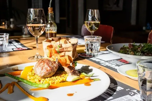 Plate of food on table with drinks